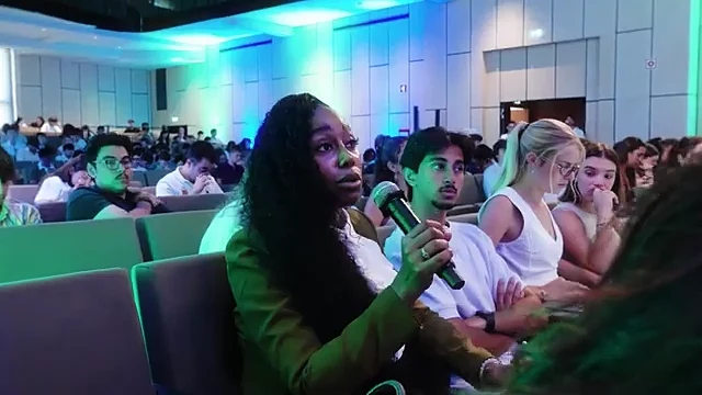 A student asking a question from the floor