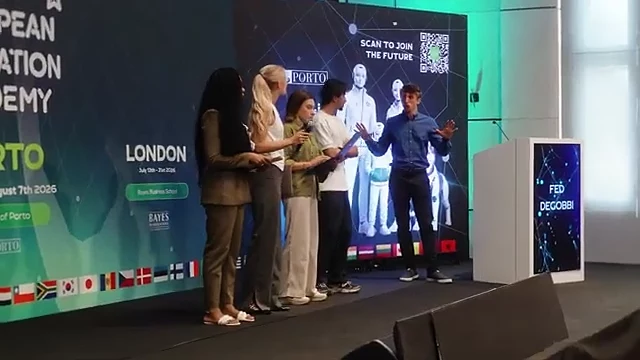 A team presenting on stage at EIA 2026